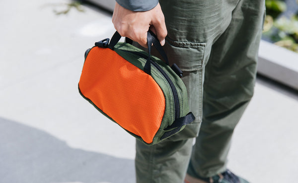 Person carrying the Grab Bag by its top handles.